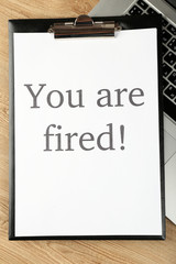 Message You're Fired on laptop keyboard, closeup