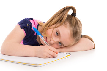 Blond kid girl student with spiral notebook in desk