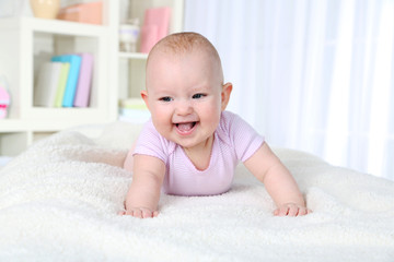 Cute baby girl, on home interior background