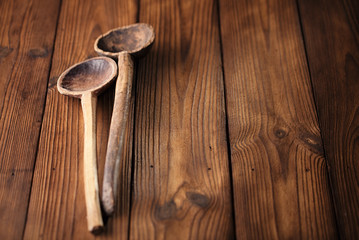 antique vintage wooden spoon on old wooden table in rustic style