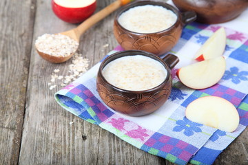 Oatmeal on old wooden table