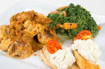 Chicken with sauce and garnish.