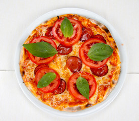 pizza with bacon, cheese and tomato