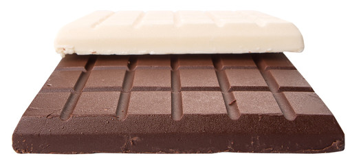 White and dark brown chocolate bars over white background