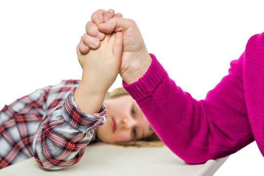 Adult arm wrestling with young girl