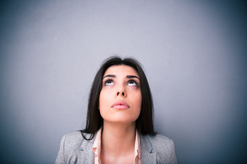 Fototapeta premium Closeup portrait of attractive young woman looking up