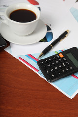 Calculator and cup of coffee