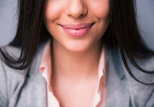 Closeup image of smiling female lips