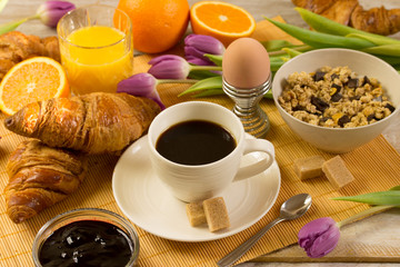 breakfast with croissants, orange juice and coffee