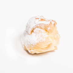 Eclair delicious dessert with cream and icing sugar