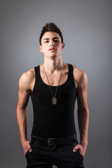 Fototapeta premium Muscular built man with a dog tags.