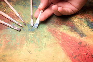 Painting of abstract painting with paintbrushes