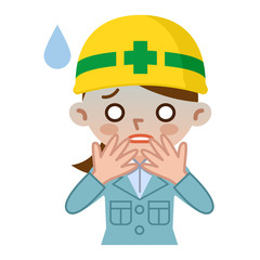 失敗して顔色が悪い若い女性　ヘルメット　作業着