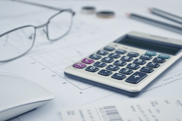 Calculator button plus, glasses coin pencil and mouse on graph p