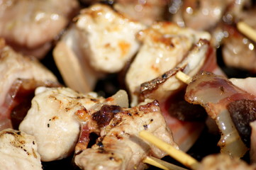meat skewers being grilled