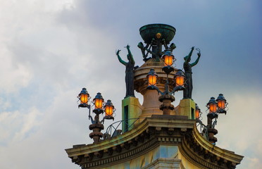 Sculptures with lanterns at Plaza of Spain in Barcelona