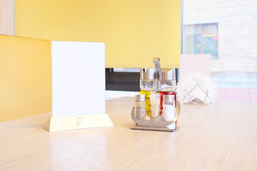 Bottles with olive oil, vinegar, salt and pepper, napkin