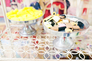 Multicolored candies in silver bowl