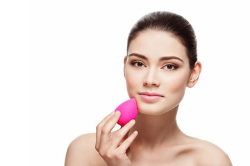 Girl with beauty blender sponge