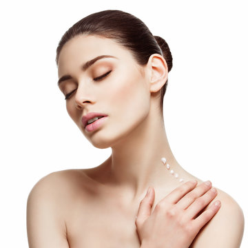 Girl applying cream on neck