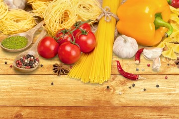 Food. Pasta spaghetti, vegetables and spices, isolated on white