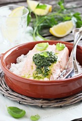 Steamed salmon with pesto and rice garnish.Selective focus.