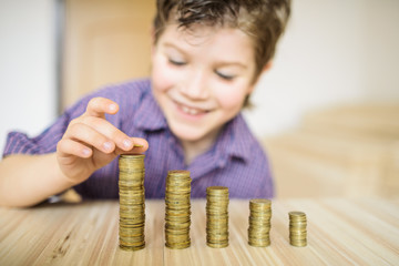 Boy puts the coin