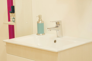 Fototapeta na wymiar Closeup of a wash basin in a modern bathroom