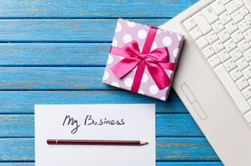 gift and paper with My Business words near notebook