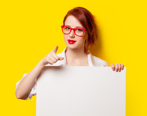 girl in shirt and glasses with white board