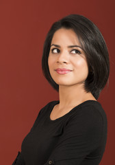 Obraz premium Beautiful thoughtful latin woman smiling