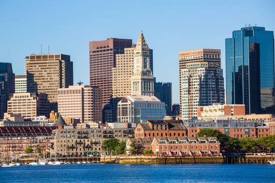 Boston skyline with river sunlight Massachusetts