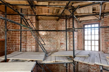 Fotobehang Monument Reconstruction of old building, panorama of scaffolding inside house