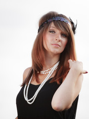 Flapper girl woman in1920s style portrait outdoor
