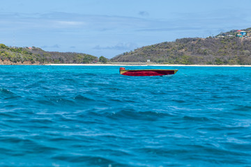 Small Red Empty Boat on Tropical Water