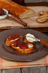 Breakfast with bread and fig jam. Selective focus.
