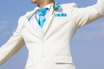 Groom on the beach on his wedding day