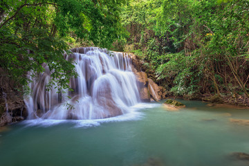 Fototapeta na wymiar tropical waterfall in Deep forest