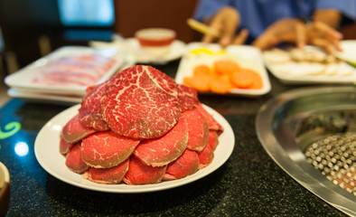Fresh red meat ready on dish for BBQ.