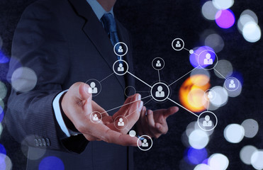 businessman hand showing human icon flow chart on new modern com