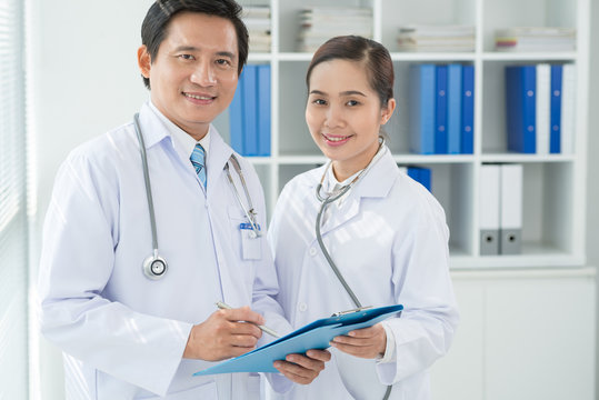 Asian doctors with medical document