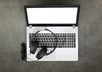 top view of workspace of composing music concept with headphone