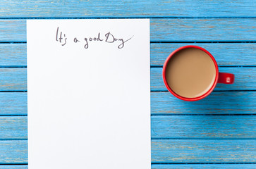 coffee and paper with Good day inscription