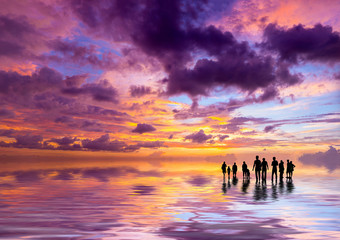 Silhouettes of people at sunset on the beach of Kuta Bali I