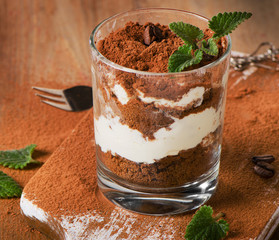 Sweet dessert -Tiramisu cake  in a glass.