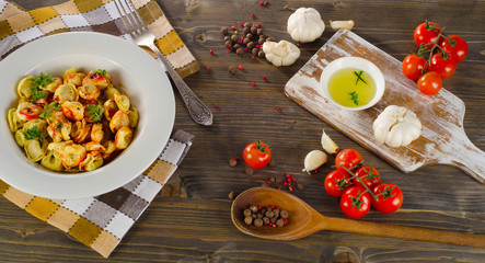 Ravioli pasta with  tomato sauce and fresh herbs.
