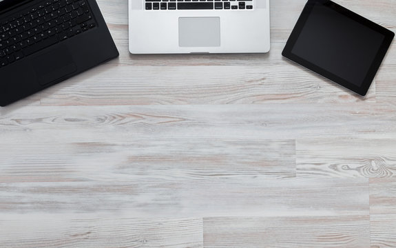 Wooden desk with many electronic devises