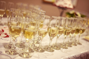 Many glasses of wine on table