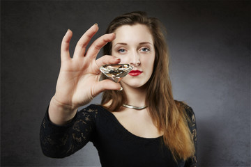 Fototapeta premium Elegant lady holding big diamond in front of her