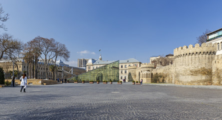 Naklejka premium Glass entrance to the subway and the ancient fortress in Baku